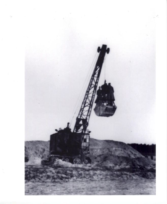 Men atop the Treblinka Excavator